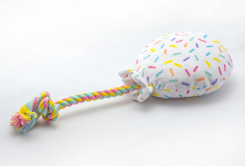 Plush dog toy shaped like a birthday balloon from Luna Doodle Boutique, soft and colorful for pets.