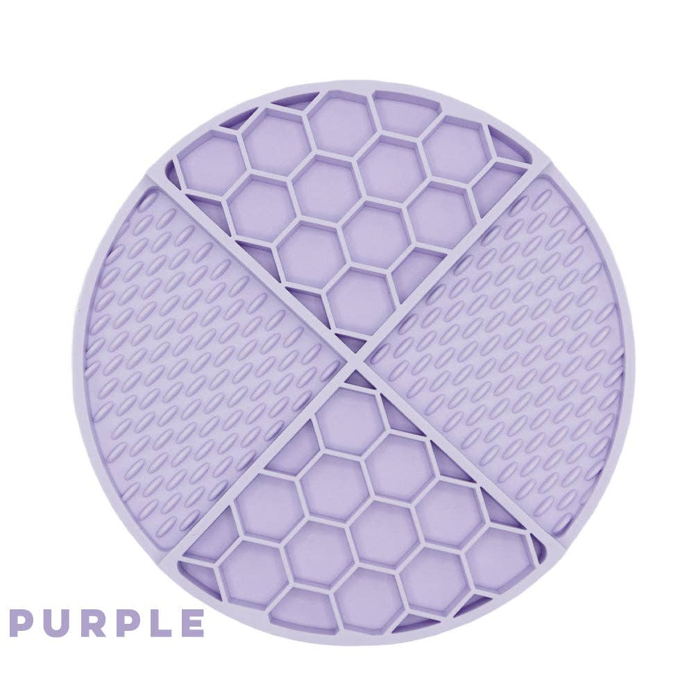 Purple SASSY WOOF dog lick mat with textured surface for engaging and calming pet play.