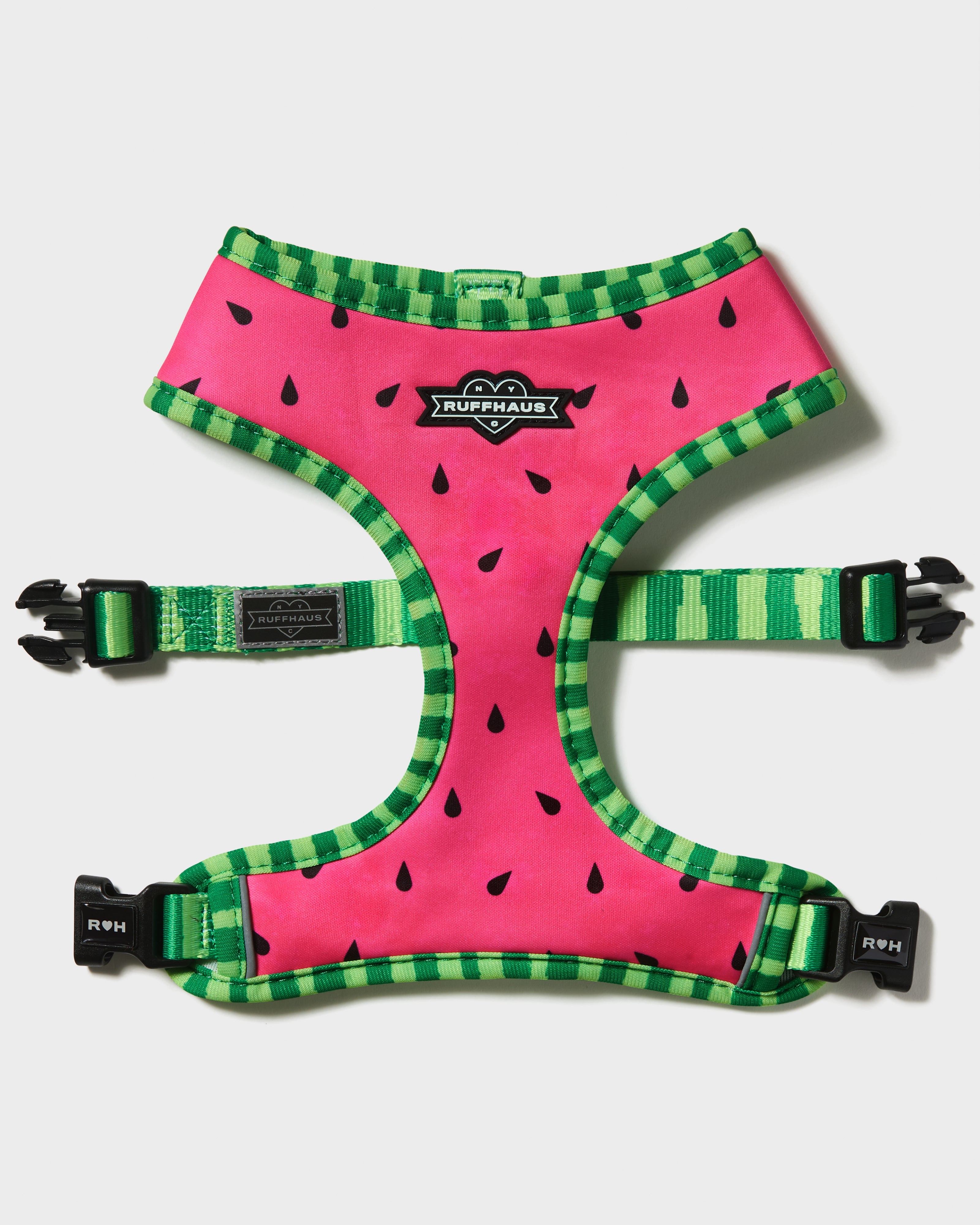 Reversible watermelon-themed dog harness by RUFFHAUS NYC, showing red and green sides with adjustable straps and buckles.