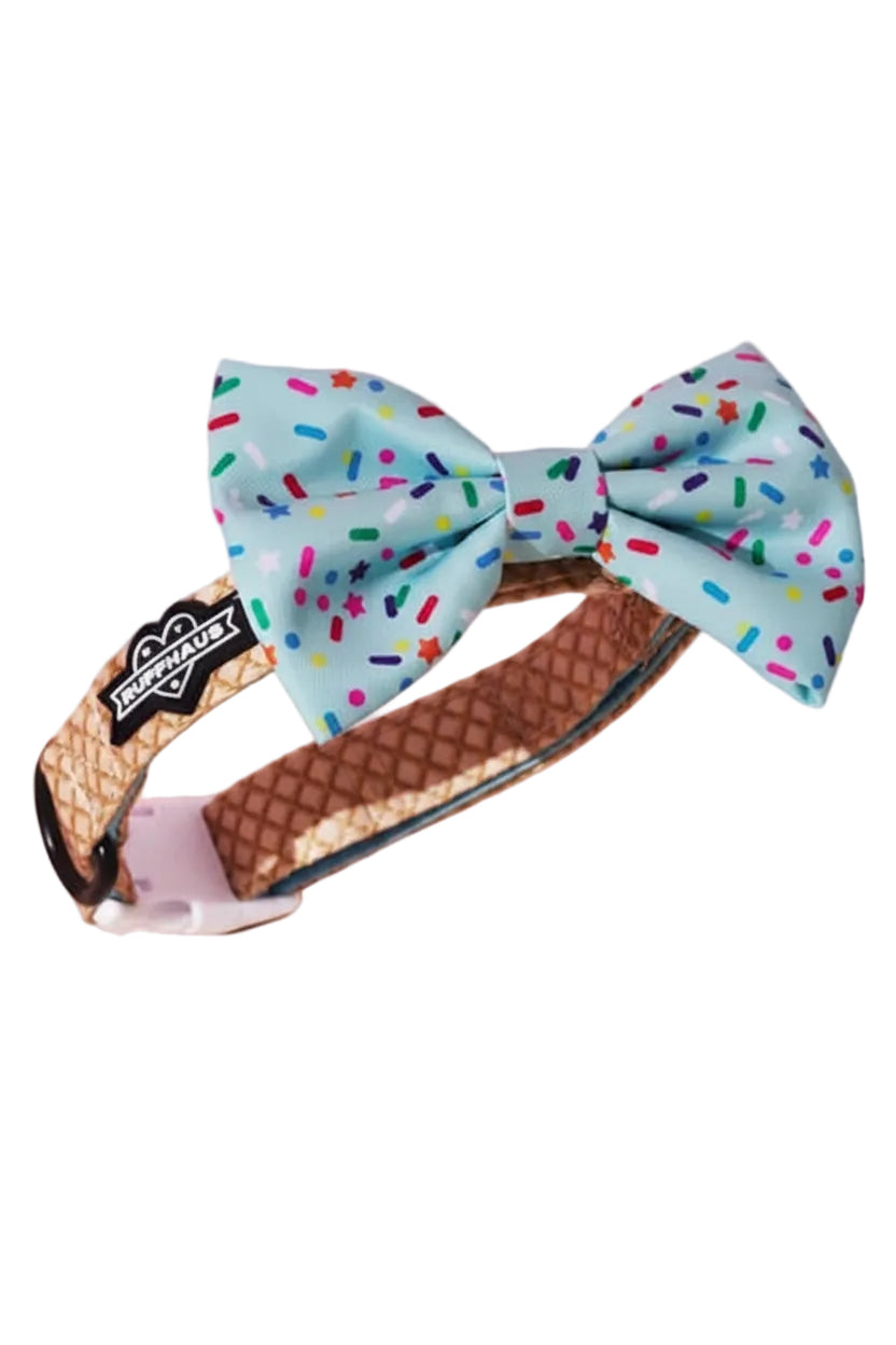 Blue dog collar with matching bowtie by Luna Doodle Boutique, featuring a playful sprinkle pattern for pets.