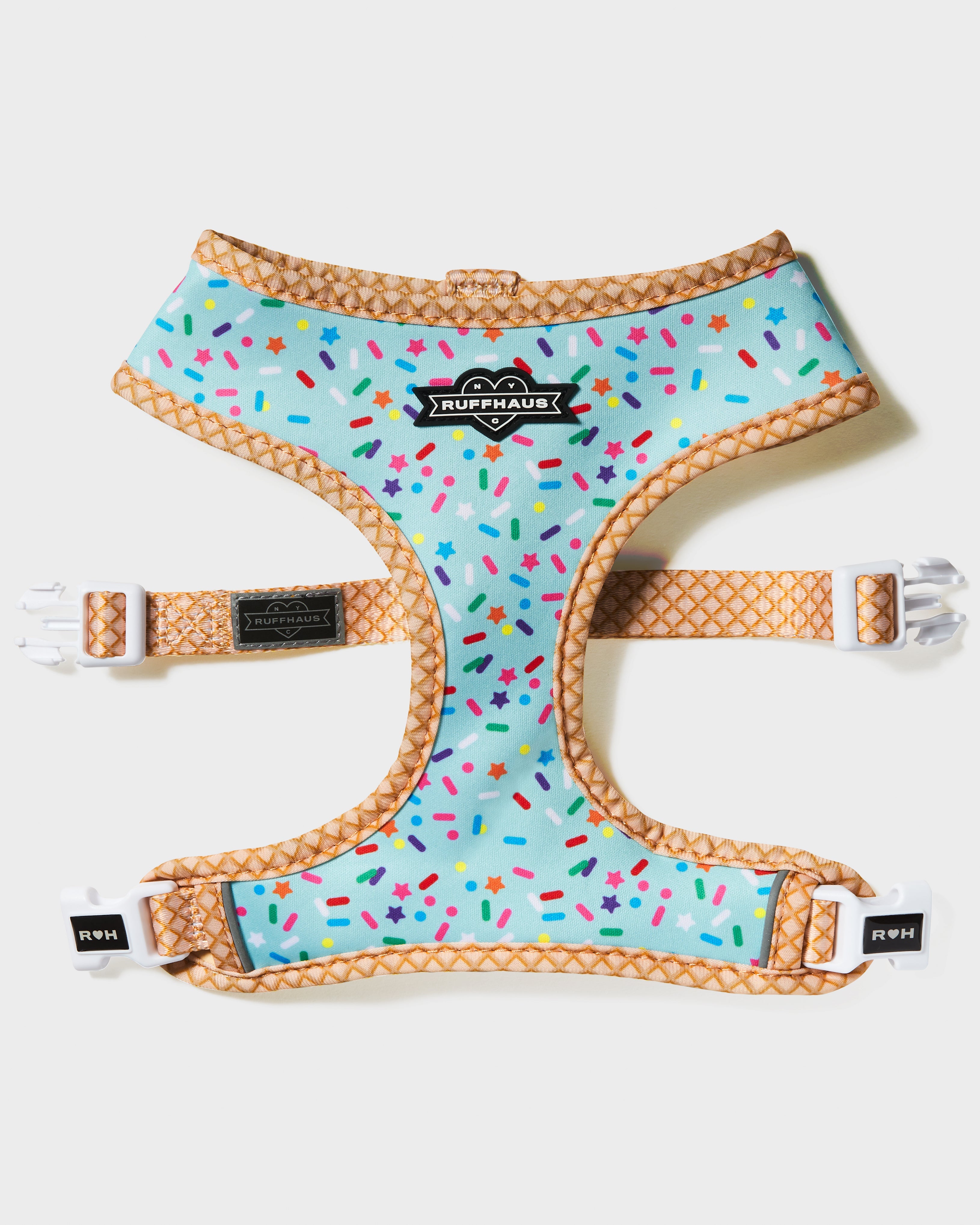 Blue reversible dog harness by RUFFHAUS NYC featuring adjustable straps and a secure buckling system.
