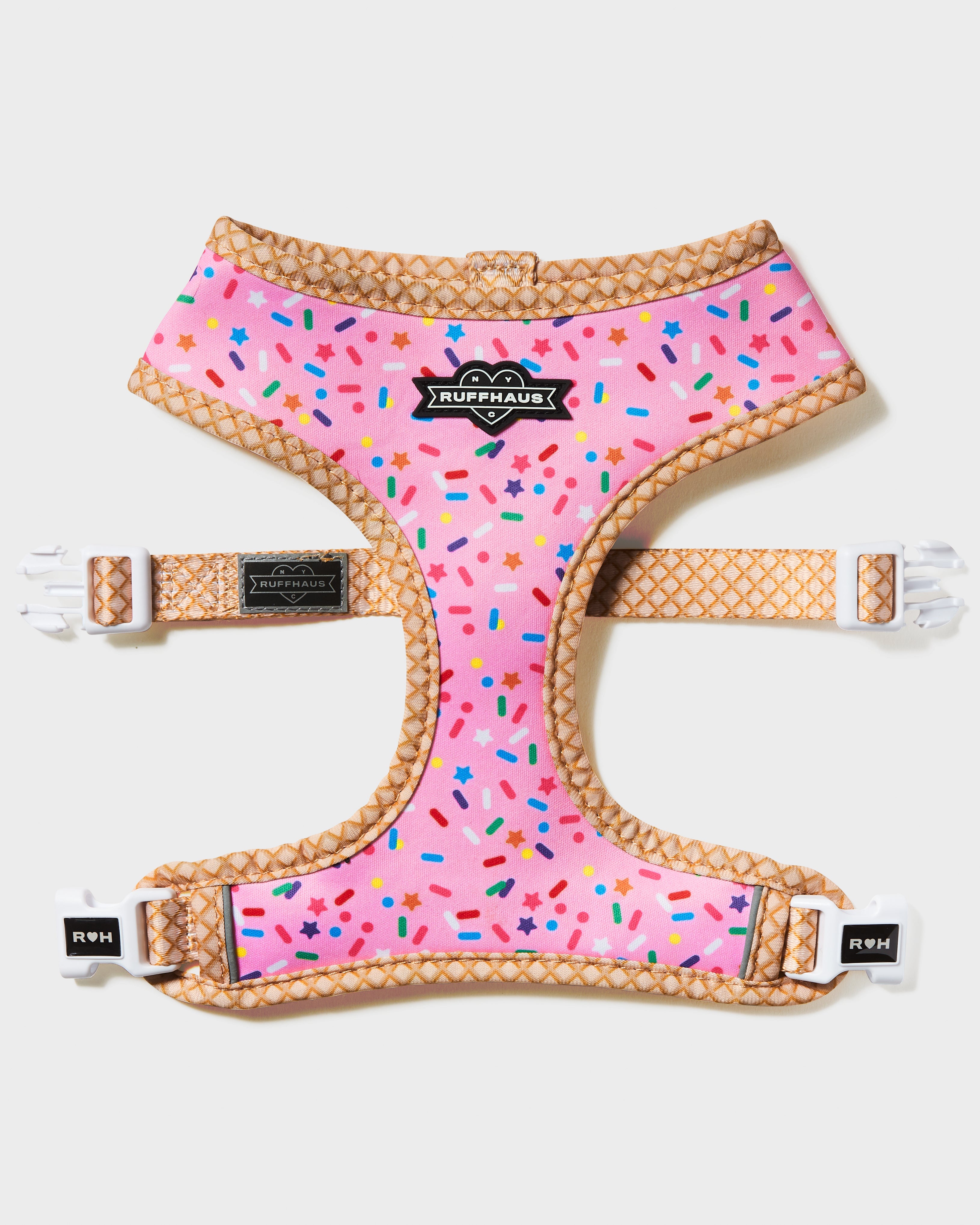 Pink reversible harness for dogs by RUFFHAUS NYC featuring a stylish design on both sides and adjustable straps.