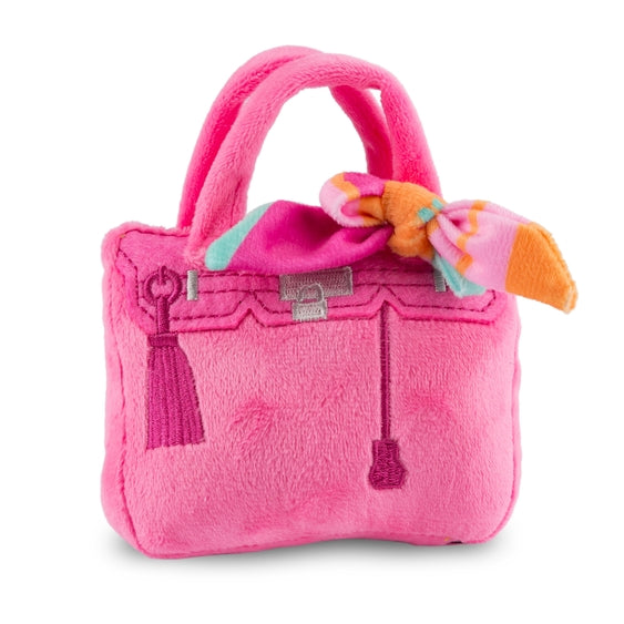 Pink plush purse dog toy with a scarf and squeaker, designed for small pets, by Luna Doodle Boutique.
