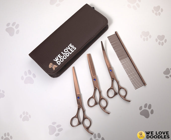 Professional dog grooming scissors kit from Luna Doodle Boutique with stainless steel scissors and grooming tools.